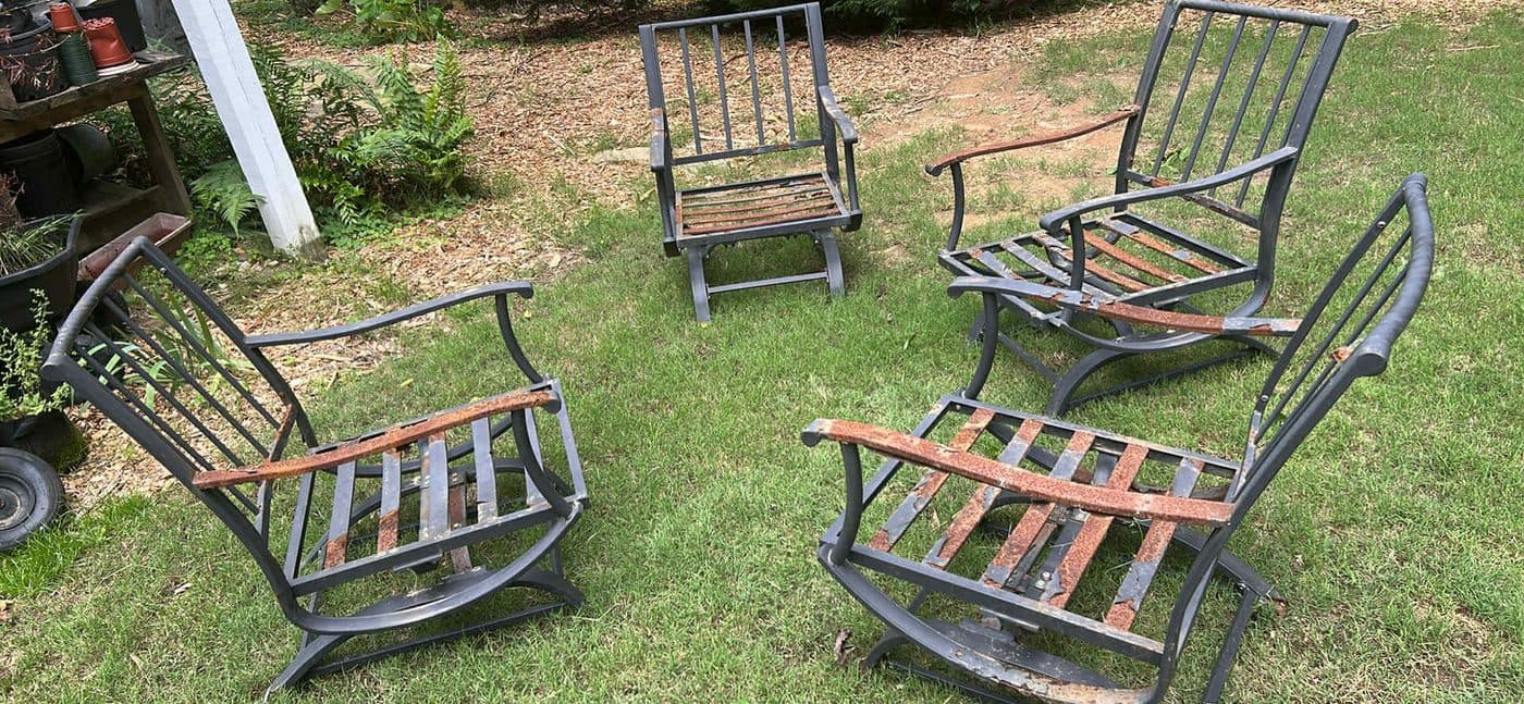 Metal patio chairs staged for junk removal pickup in Cumming, GA